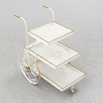 A white lacquered metal and brass serving trolley, 1940's-50's.