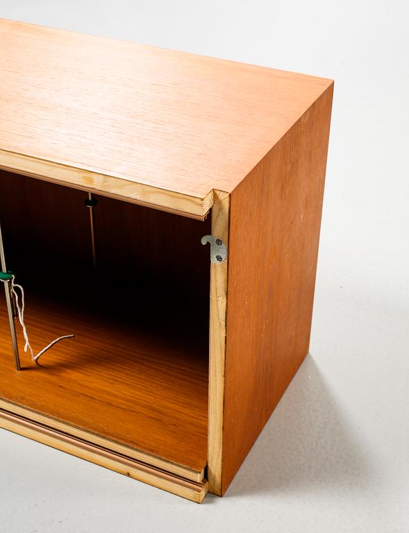 A 1950s shelving system,"Veggen de Luxe" by Torbjørn Afdal & Rolf Hesland for i.a. Ringerike Møbel- og Trevarefabrikk.