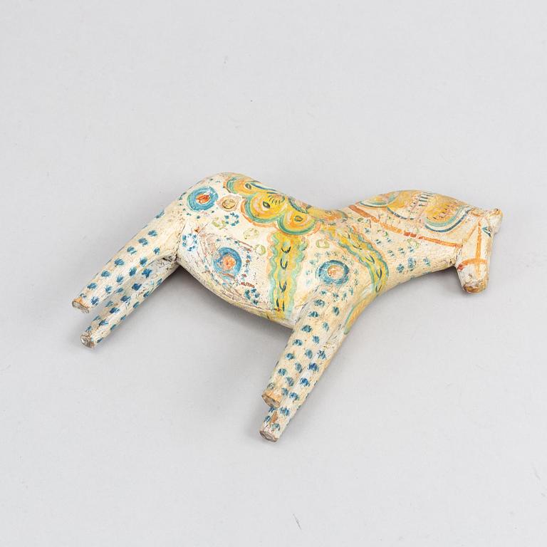 A painted Swedish wooden horse from the first half of the 20th century.