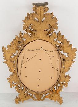 A 20th century Baroque style mirror.