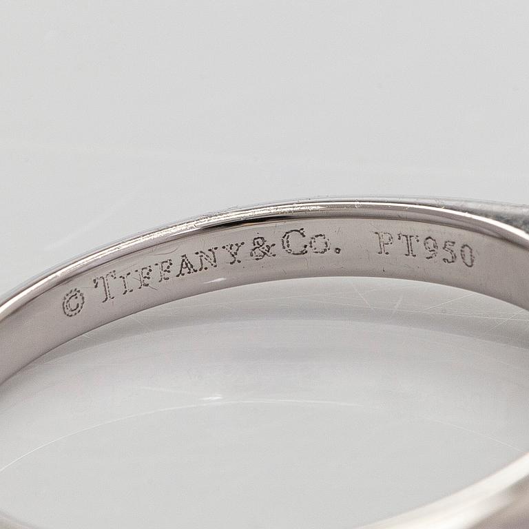 Tiffany & Co, a platinum solitaire ring with a brilliant-cut diamond.