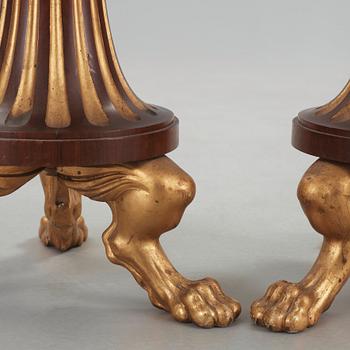 A pair of Empire 19th century candle stands.