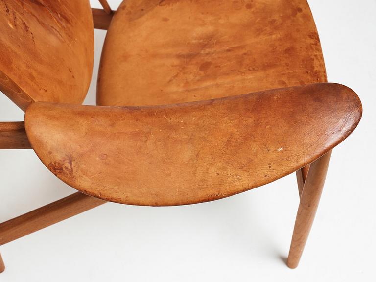 Finn Juhl, a teak and natural brown leather "Chieftain Chair" by Niels Vodder, 1950-60's.