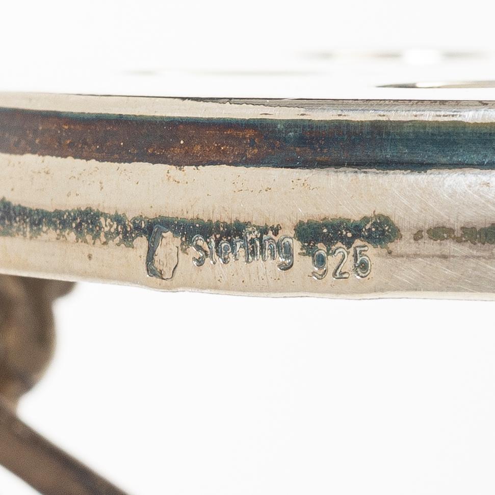 Base/holder for a burner, sterlingsilver, 20th century.