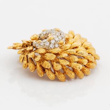 An 18K gold brooch set with round brilliant-cut diamonds and a pair of 18K gold earrings.