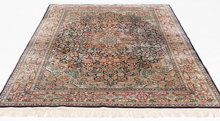 An oriental carpet, mercerized cotton, c. 275 x 182 cm.