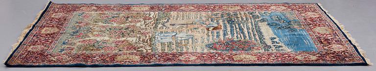 A CARPET, a semi-antique Kerman figural, ca 248,5-250 x 155 cm.