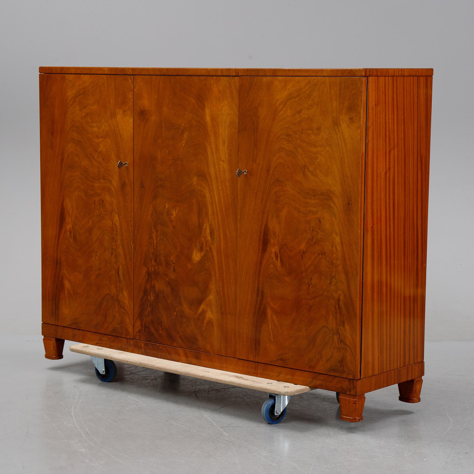 A 1940's Swedish Modern mahogany veneered cabinet.