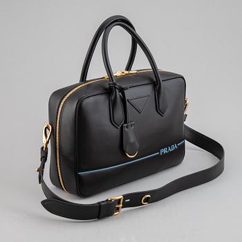 PRADA, a leather bag.