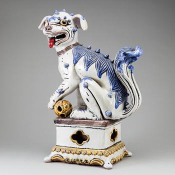 A large Chinese ceramic tile sculpture of a buddhist lion, 20th century.