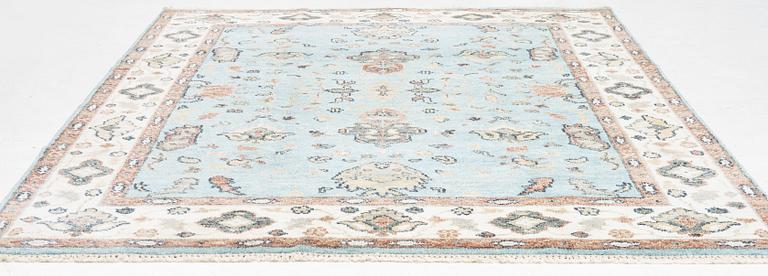 An Agra carpet, c. 302 x 239 cm.