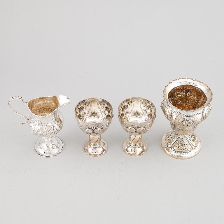 A mixed lot of two beakers, a vase and a jug, Baroque style, silver 830, 20th century.