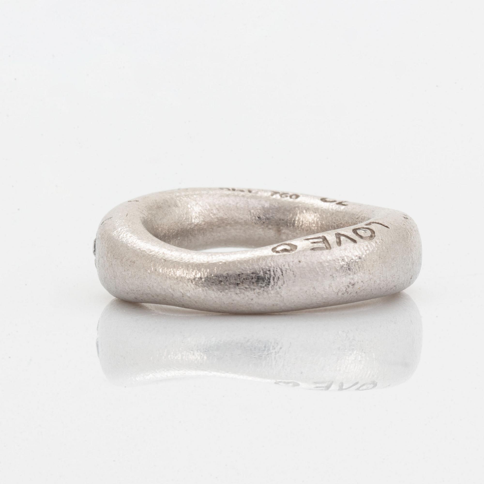 Ole Lynggaard "love ring" with brilliant-cut diamonds.