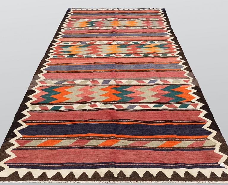 A persian Nomad Kilim carpet, c 375 x 195 cm.