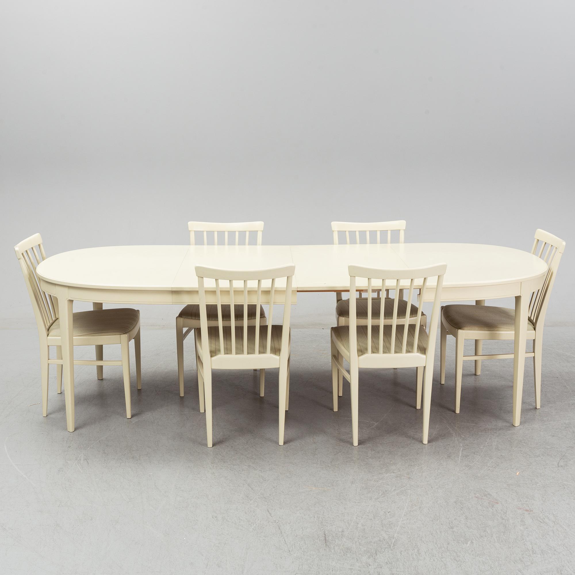 A dining table with six chairs by Carl Malmsten. Second half of the 20th Century.