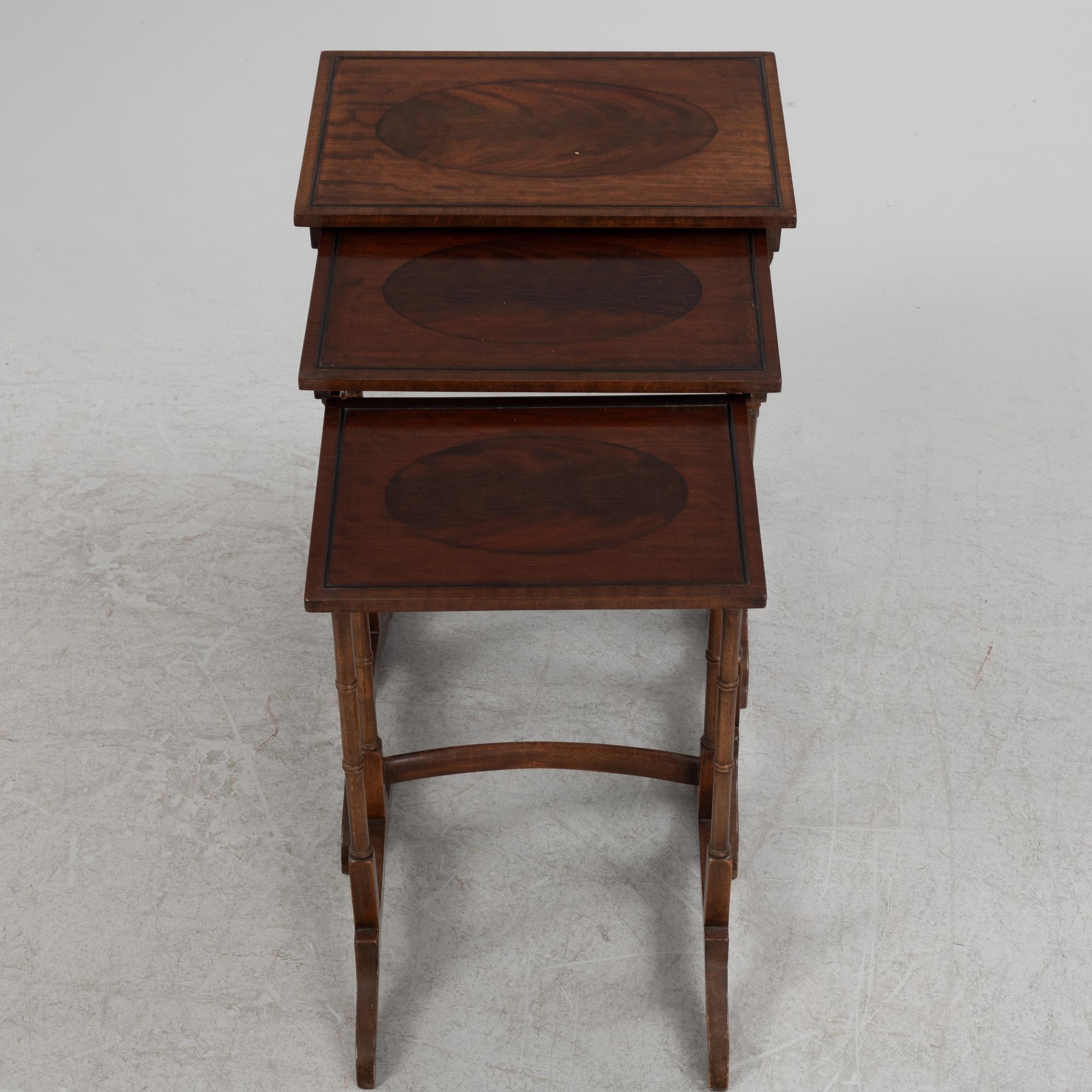 Three-piece nest of tables, mid-20th century.