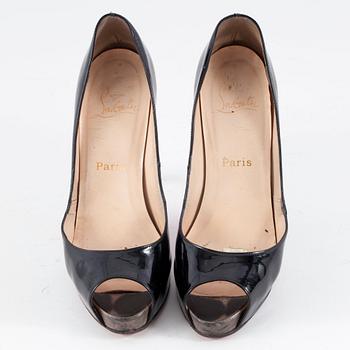 CHRISTIAN LOUBOUTIN, a pair of black leather peep-toe pumps. Size 37 1/2.