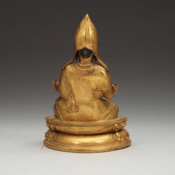 A Sino-Tibetan gilt copper alloy repoussé figure of Tsong Khapa, 18/19th Century.