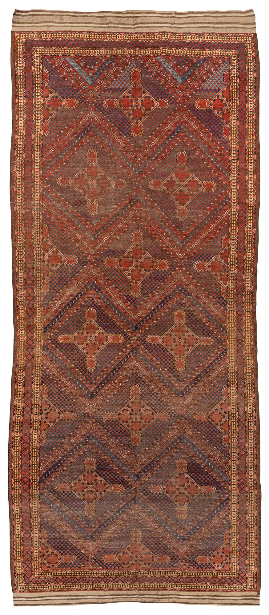 An antique Beshir carpet, ca 495 x 206 cm, around the year 1875.