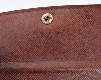 A monogam canvas purse by Louis Vuitton, model "M61735".