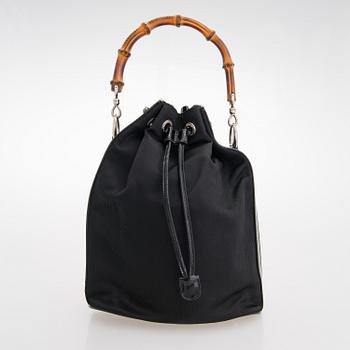 GUCCI, a black nylon handbag.