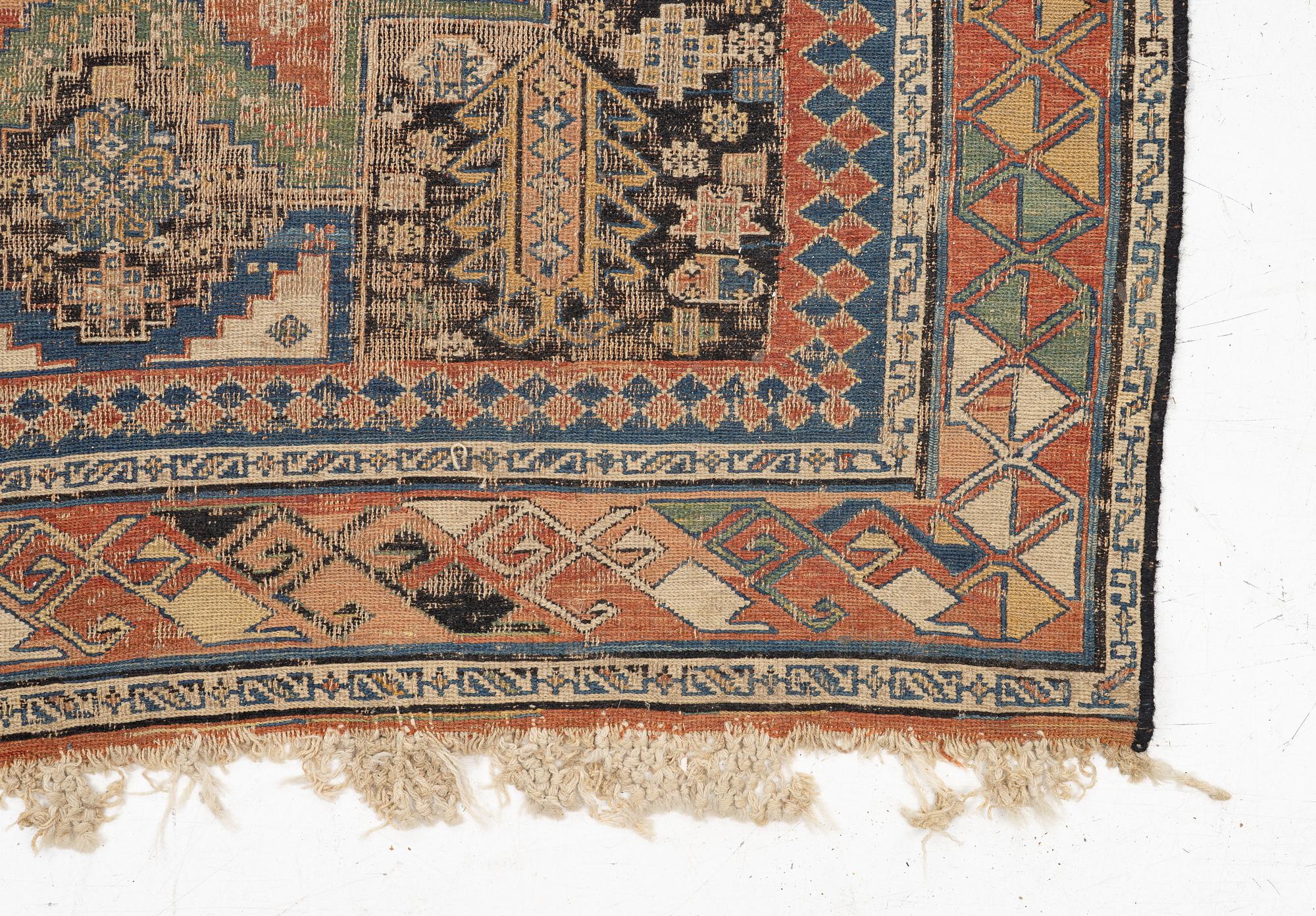 An oriental carpet, c 280 x 130 cm.