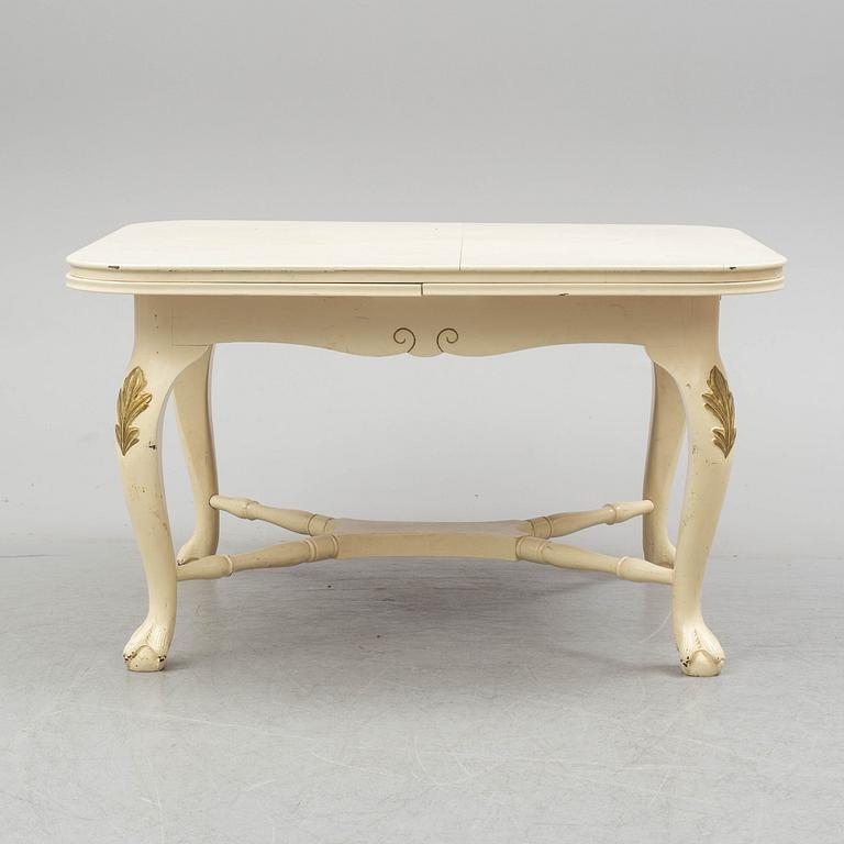 A dining table and six chairs, rococo style, mid 20th century.