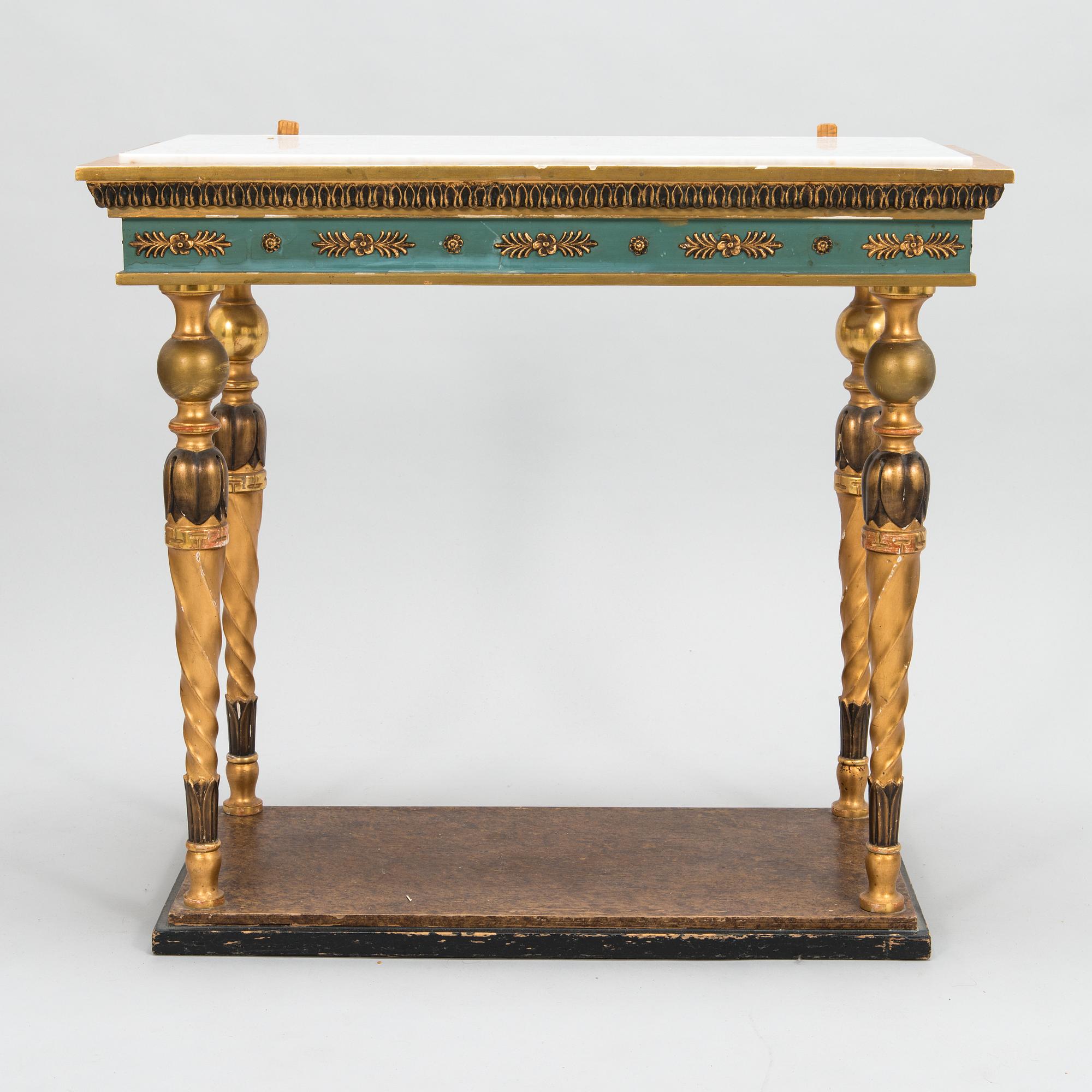 An early 20th century mirror with console table in late Gustavian style.