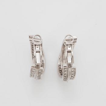 A pair of Cartier "Trinity" earrings in 18K white gold set with round brilliant-cut diamonds.