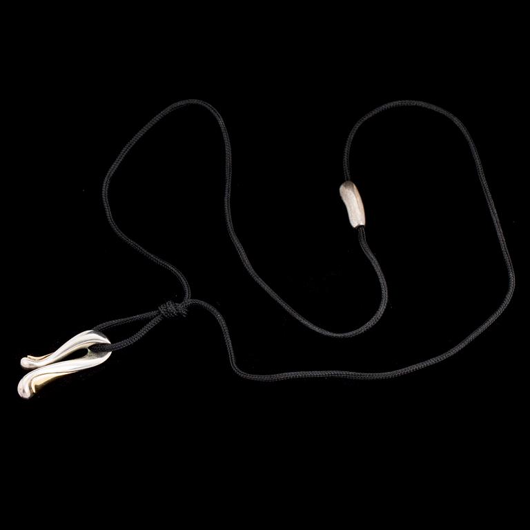 A silver and gold pendant by Minas Spiridis for Georg Jensen, designed in the 1990's.