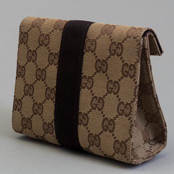 GUCCI, a monogram fabric hand bag and beauty bag.