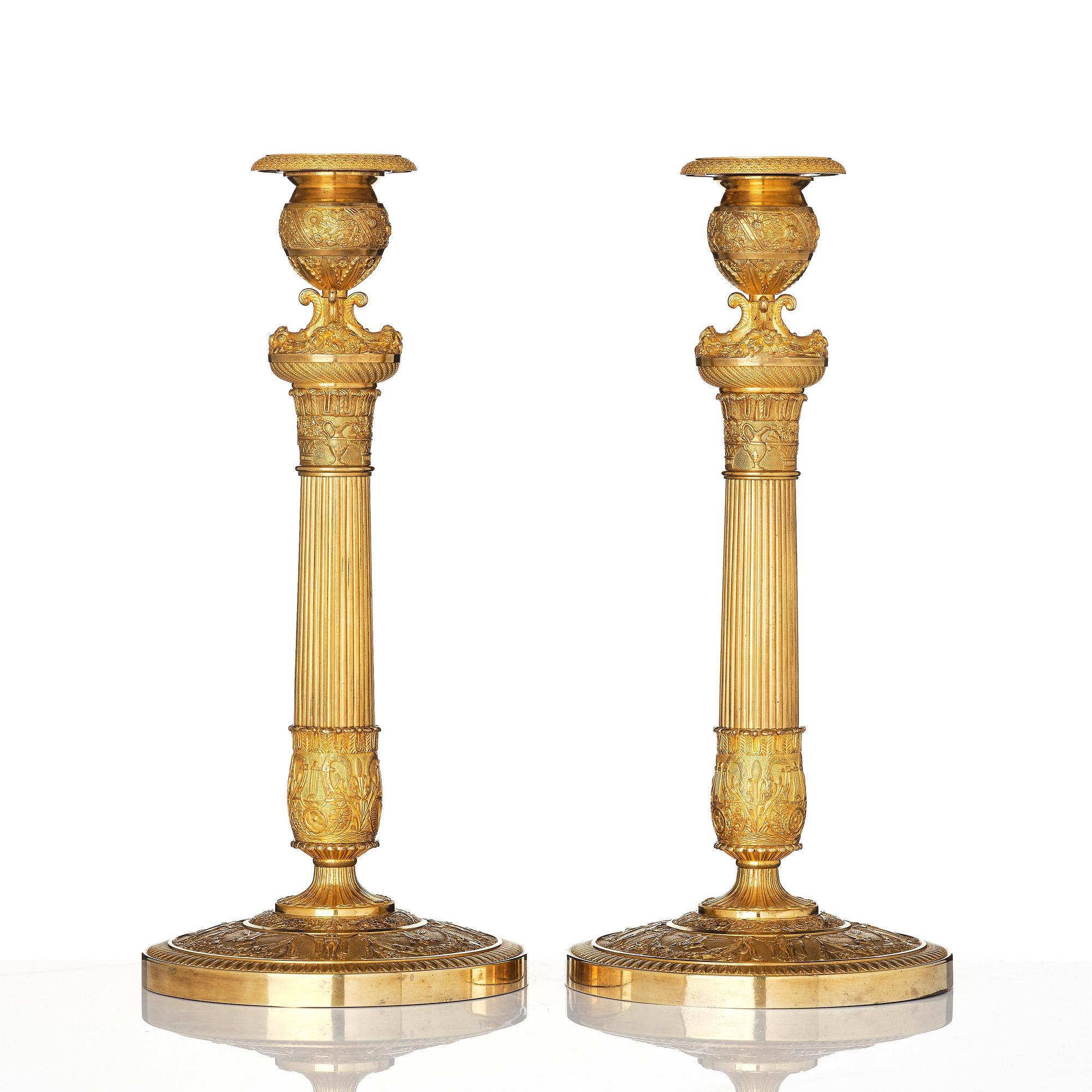 A pair of French Empire candlesticks, early 19th century.