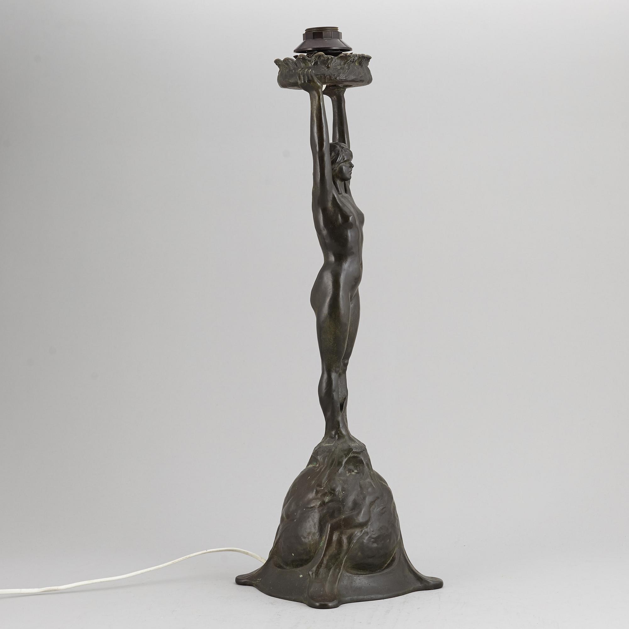 GERDA SPRINCHORN, an Art Nouveau green patinated bronze lamp "The Sun", Herman Bergman, Stockholm, early 20th century.