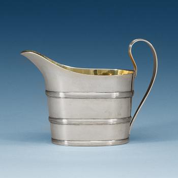 906. A Swedish early 19th century parcel-gilt cream-jug, makers mark of Stephan Westerstråhle, Stockholm 1807.