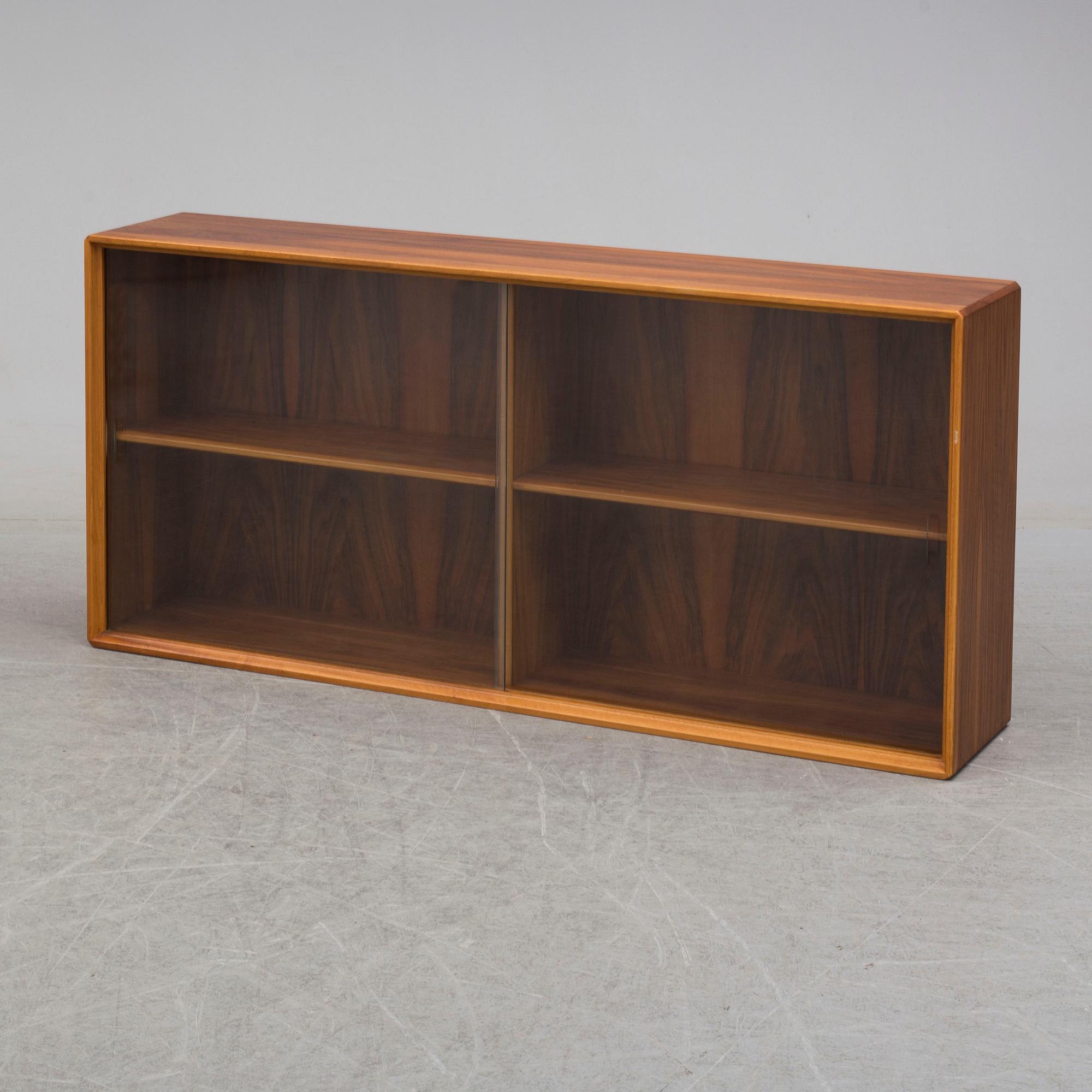 A 1960s walnut veneer wall cabinet.