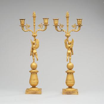 A pair of French Empire early 19th century two-light candelabra.