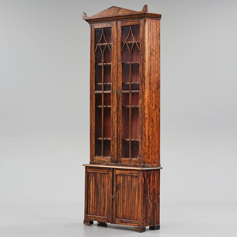 A Swedish faux-boix neo-gothic book cabinet, ca 1830.