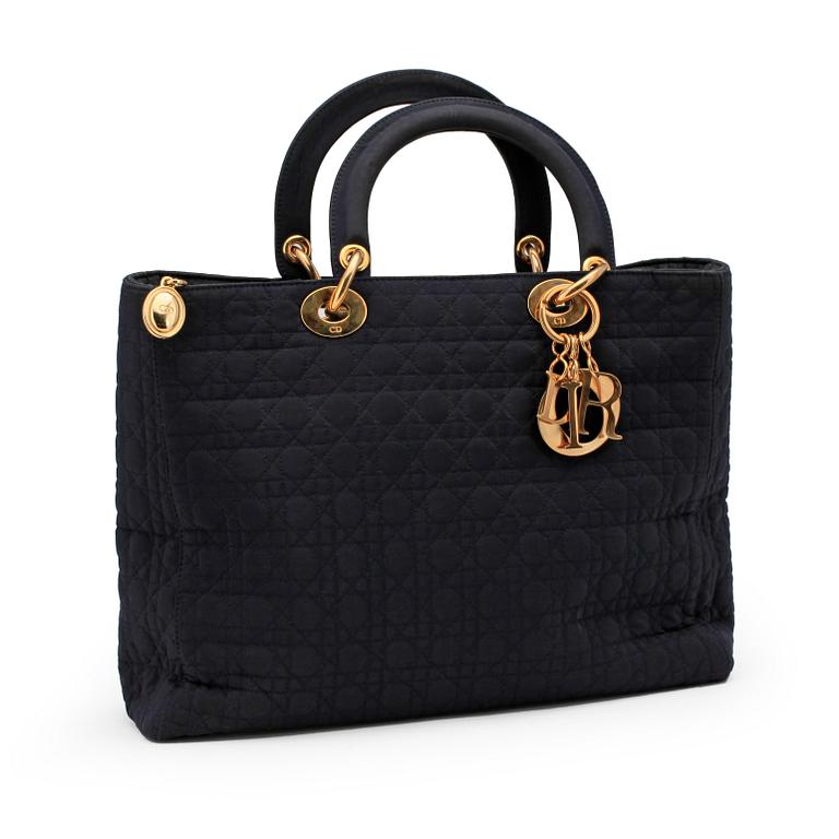 CHRSITIAN DIOR, a dark blue handbag.