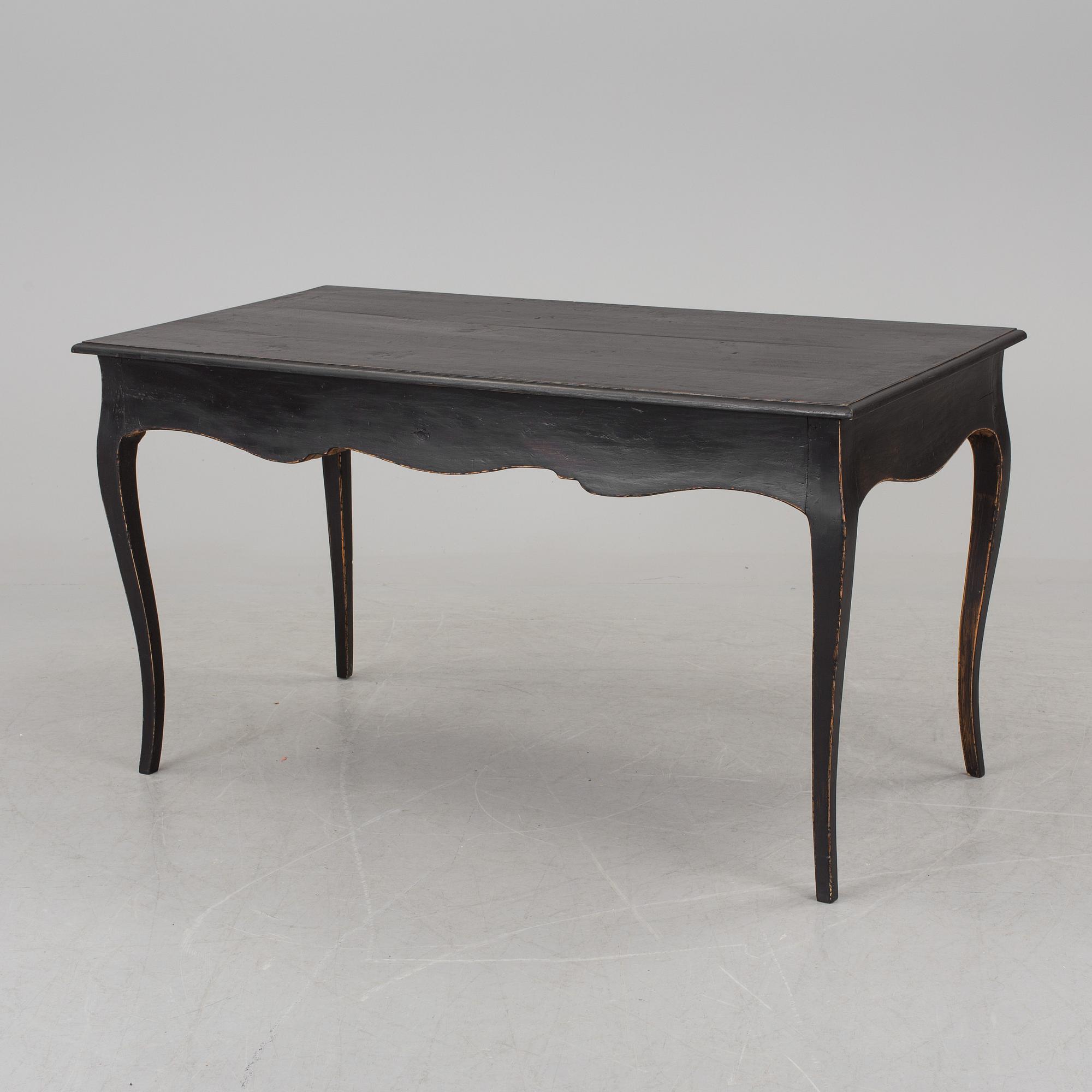 A partially rococo, 18th century writing desk.