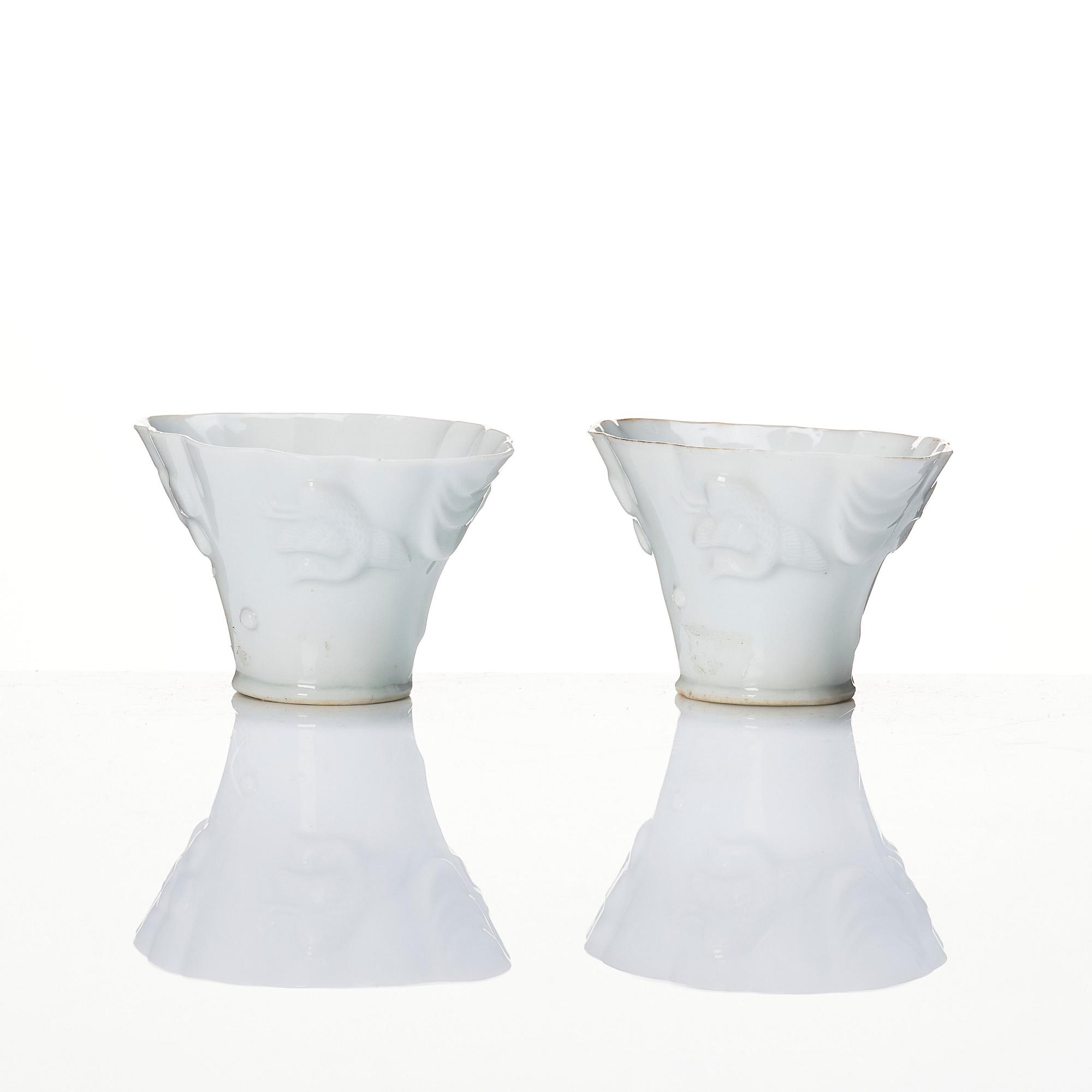 A pair of blanc de chine libation cups, Qing dynasty, 19th Century.
