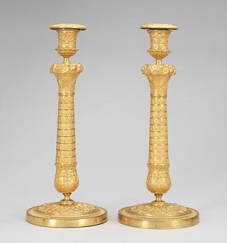 A pair of French Empire early 19th Century candlesticks.