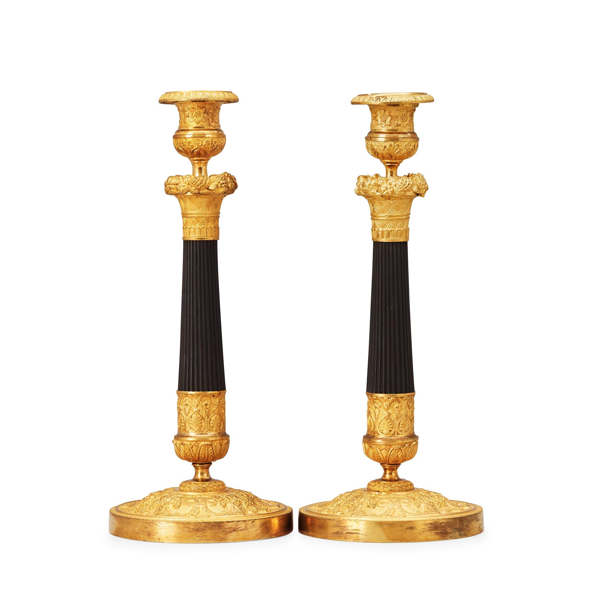 A pair of French Empire 19th century candlesticks.