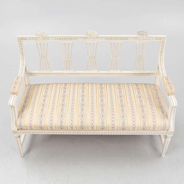 A sofa, three chairs and a table, Gustaivan style and of the Gustavian period, 19th-20th century.