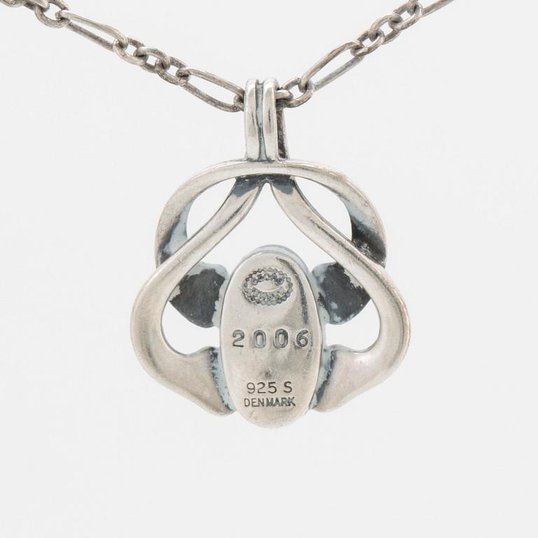 A silver and moonstone jewellery set consisting of necklace and earrings by Georg Jensen, jewellery of the year 2006.