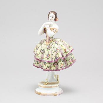 A porcelain figurine by Aelteste Volkstedter Porzellanmanufaktur in Rudolfstadt, made around year 1900.