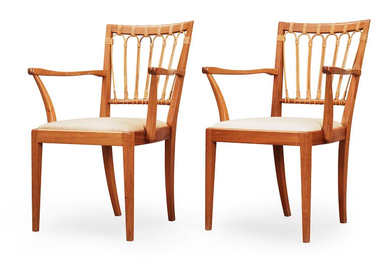 A pair of Josef Frank mahogany chairs, Svenskt Tenn, model 1165.