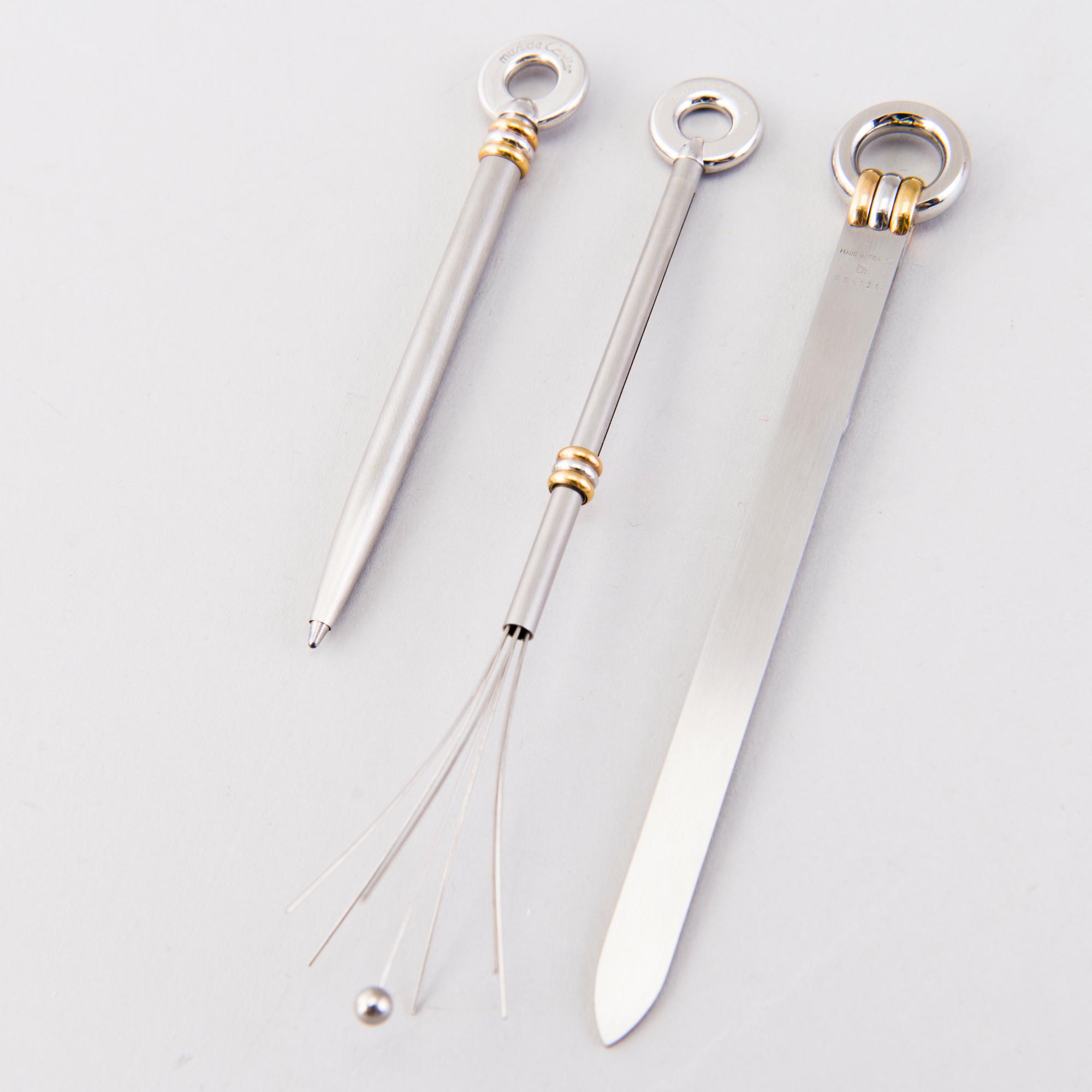 A PEN, CHAMPAGNE BEATER and BOOK MARK, must de Cartier.