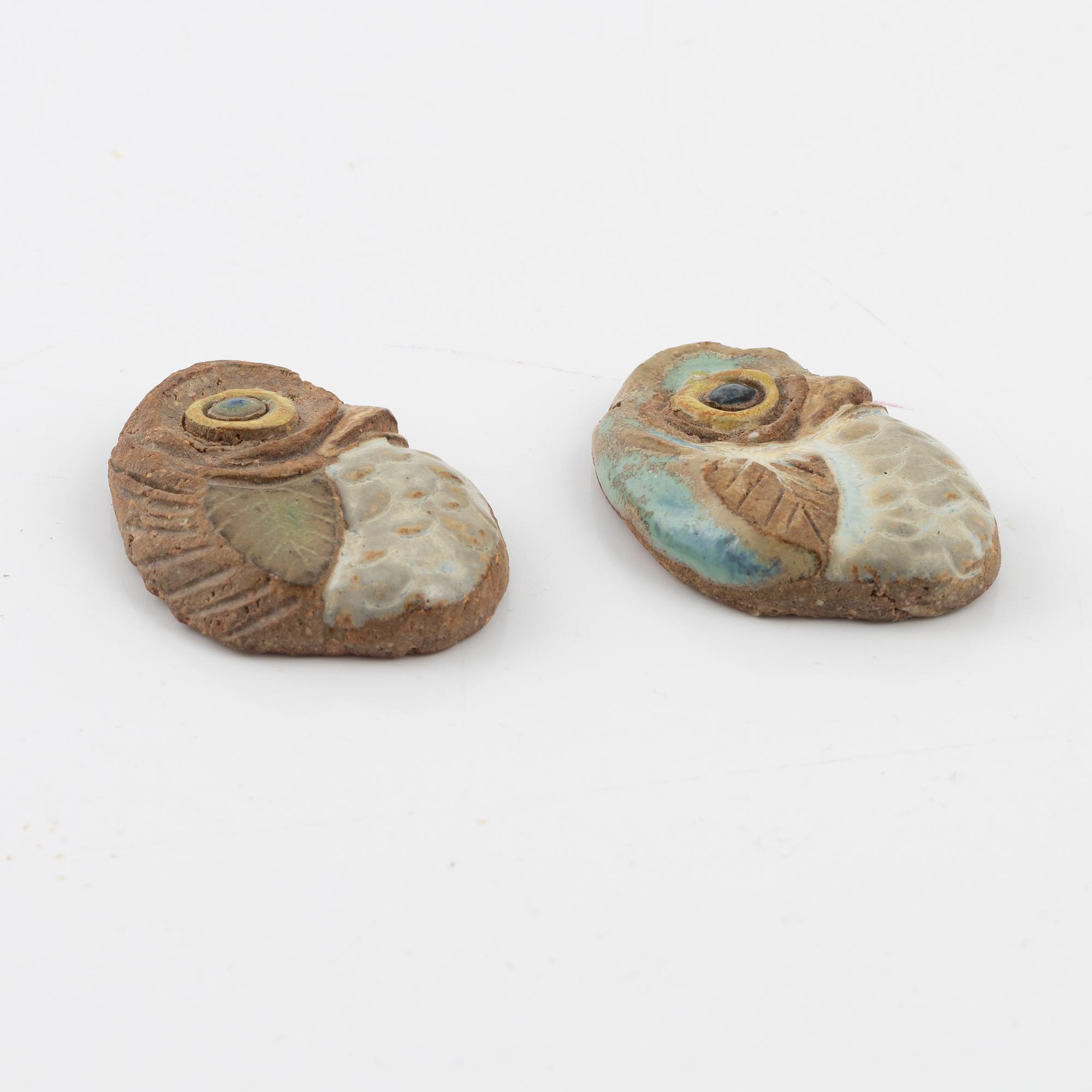 Tyra Lundgren, two stoneware pendants.