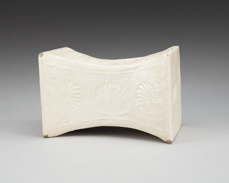 A cream glazed pillow, Song/Jind dynasty. With seal marks of a family and a date to the short sides.