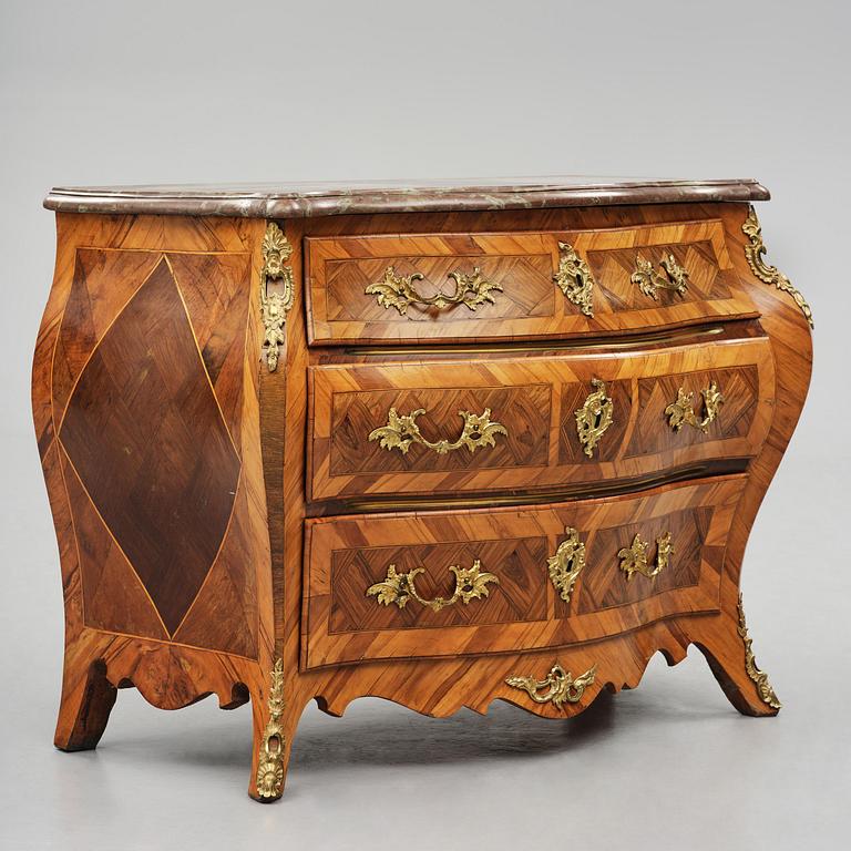 A rococo parquetry and gilt brass-mounted commode attrbuted to M. Engström (master in Stockholm 1758-97).